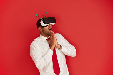 Focused Man Trying VR. Portrait of Amazed Guy Discovering New Technologiesの写真素材