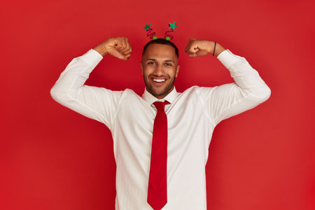 Multiracial Man Showing Biceps. Portrait of Confident Proud Man Showing Bicepsの写真素材