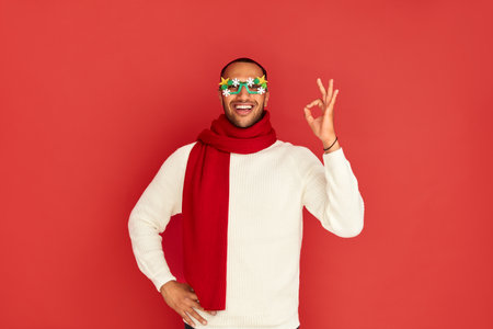 Smiling Man Showing Ok Gesture. Satisfied Multiracial Guy Making Ok Symbolの写真素材