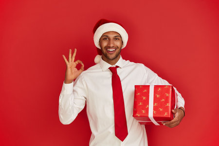 Smiling Man Showing Ok Gesture. Satisfied Guy Making Ok Symbolの写真素材