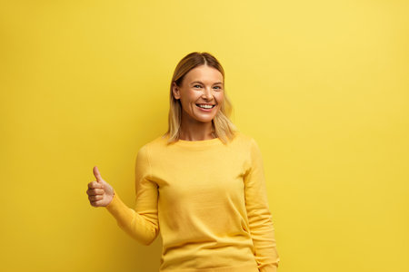 Smiling Woman Showing Big Fingers Isolated. Happy Smile Girl Looking at Cameraの写真素材