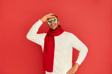 Smiling Man Posing Studio. Portrait of Happy Multiracial Guy Fooling Aroundの写真素材