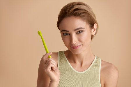 Healthy White Teeth. Portrait Of Woman Holding Toothbrush With Toothpasteの写真素材