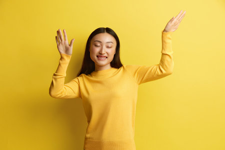 Asian Woman Dancing Isolated. Portrait of Ecstatic Overjoyed Lady Dancingの写真素材