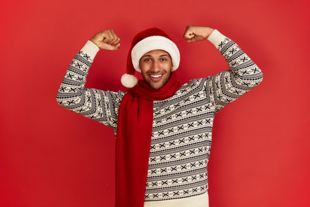 Multiracial Man Showing Biceps. Portrait of Confident Proud Man Showing Bicepsの写真素材