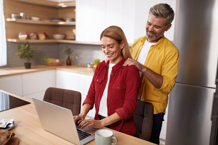 Mature Couple Using Laptop Together. Husband And Wife Computer Social Networkの写真素材