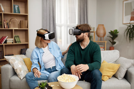 Happy Couple Playing VR Games. Boyfriend And Girlfriend Enjoying Virtual Realityの写真素材