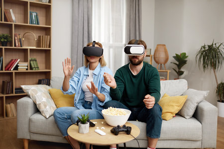 Happy Couple Playing VR Games. Boyfriend And Girlfriend Enjoying Virtual Realityの写真素材
