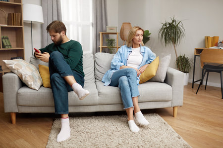 Couple Having Argument At Home. Angry Spouses Dont Speak With Each Otherの写真素材