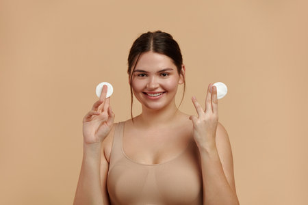 Woman Cleaning Face With White Pad. Girl Removing Makeup Cosmetic Cotton Padの写真素材