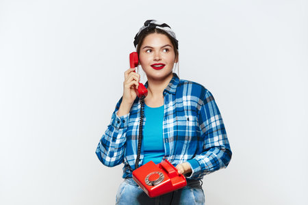 Woman Talking Landline Telephone. Plus Size Girl Speaking on Retro Phoneの写真素材
