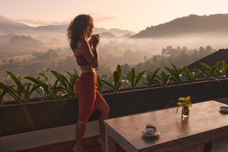 Tropical Woman Drink Tea. Beautiful Lady Drinking Coffee At Terraceの写真素材