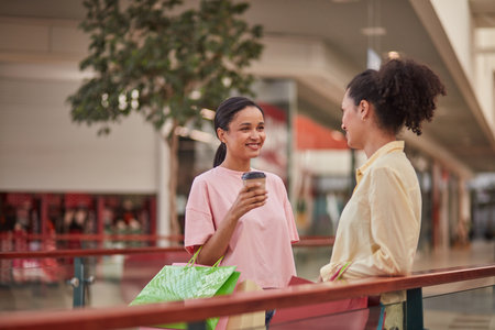Happy Friends Shopping Together at the Mall, Smiling and Talkingの写真素材