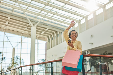 Happy Woman with Shopping Bags at the Mallの写真素材
