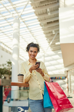 Happy Woman Enjoying Shopping with Friends in the Cityの写真素材