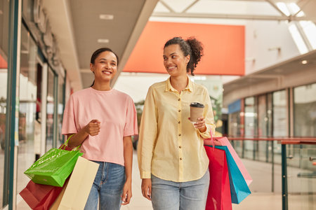 Happy Woman and Friend Shopping in City Mallの写真素材