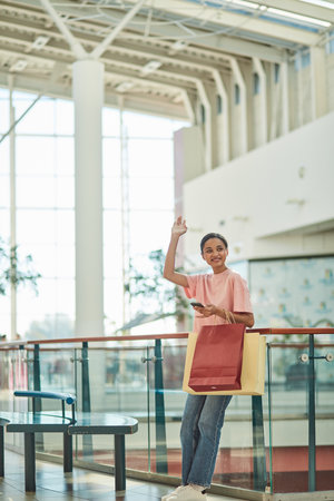 Happy Woman with Shopping Bags at the Mallの写真素材