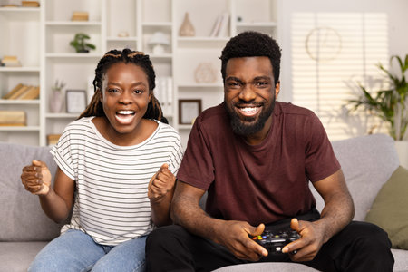 Happy Couple Playing Video Games Together at Home