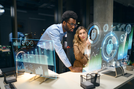 Business Professionals Analyzing Interactive Digital Data with Futuristic 3D Virtual Displaysの写真素材