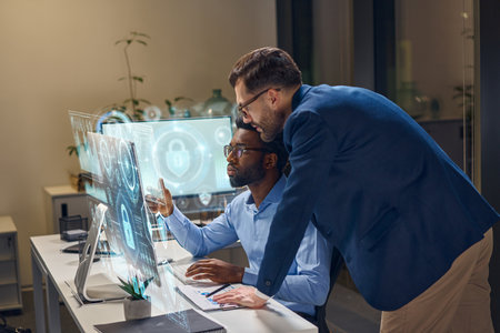 Professional Discussion on Cybersecurity at a Modern Workplace with Holographic Displayの写真素材