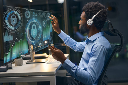 Professional Analyst Working on Cybersecurity and Data Visualization in Modern Office