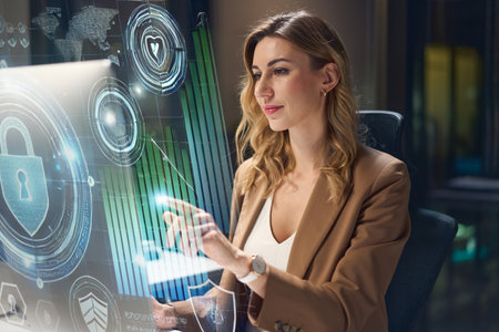 Professional Woman Using Futuristic Touchscreen Technology in a Modern Office Environmentの写真素材