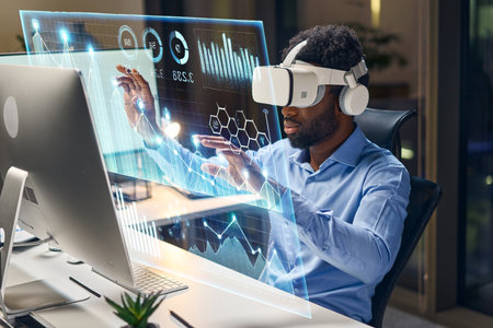 Man Using Virtual Reality for Advanced Data Analysis at Modern Office Workstationの写真素材