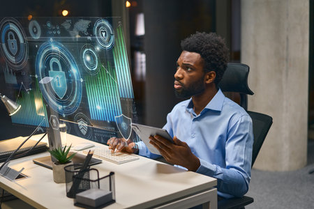 Professional Working on Cybersecurity Technology in a Modern Office Settingの写真素材