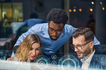 Group of Professionals Analyzing Futuristic Data on Digital Transparent Interface in Office