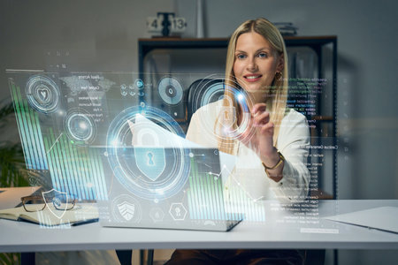 Woman Interacting With Virtual Holographic Interface in Modern Workspace Settingの写真素材