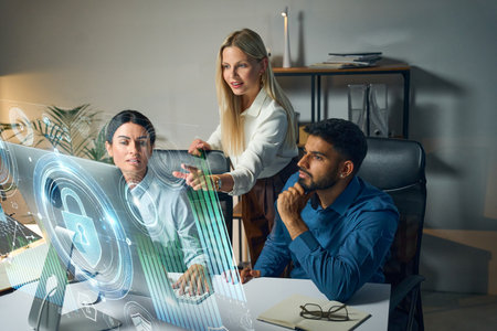 Team Analyzing Futuristic Data on Holographic Interface in Modern Office Settingの写真素材