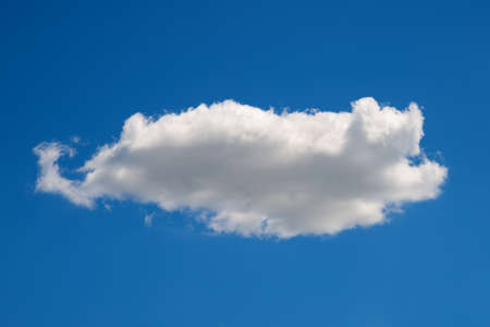 Cloud in the sky. One cumulus cloud. Natural landscape background. Beautiful wallpaper for editing and design.の写真素材