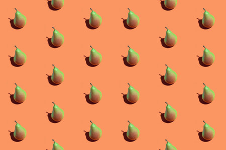 Colorful seamless pattern of fresh pears on a orange background. Fresh ripe organic pears isolated...