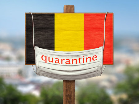 Sign on the background of the city.   A medical mask with the words "Quarantine" hangs on a plaque with the flag of Belgium. Limitations.の写真素材