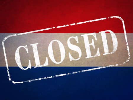 The stamp "CLOSED" on the background of the flag of the Netherlands.の写真素材