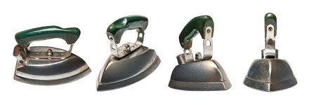 Set of old iron. Four old electric iron for ironing isolated on white background. Old household appliances. Selective soft focus.の写真素材