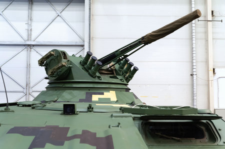Infantry fighting vehicle. A combat artillery module of a gooseneck armored vehicle of a tank at the international exhibition ARMS AND SECURITY - 2021. Selective focus. Kiev. Ukraine - June 18, 2021.のeditorial素材