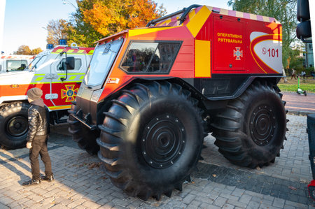 Side view of an off-road all-terrain vehicle of the rescue service. Exhibition of technology. Rescue equipment. Modern technologies. Ukraine. Kiev. October 15, 2021.のeditorial素材