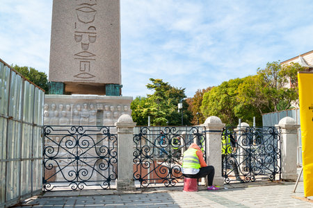 Restoration of Theodosius Obelisk in Istanbul. Workers carry out restoration work. An ancient landmark. Tourist location. Turkey. Istanbul. September 25, 2021.のeditorial素材