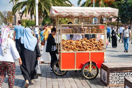 Baking seller. Street vendor of simits in Istanbul. Landmarks of Turkey. Tourist location. Turkey. Istanbul. September 25, 2021.のeditorial素材