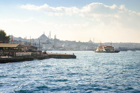 The ferry sails across the mouth of the Golden Horn in Istanbul. Sea of Marmara. Istanbul. Turkey - 09.25.2021.のeditorial素材