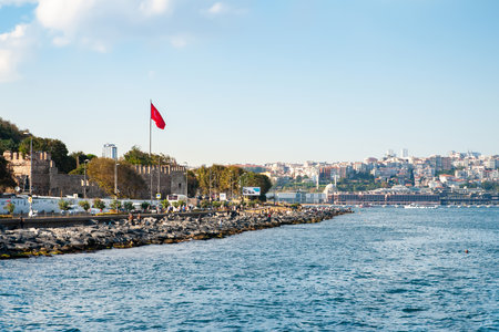 Istanbul embankment. The mouth of the Golden Horn Bay. The flag of Turkey. Istanbul. Turkey - 09.25.2021.のeditorial素材