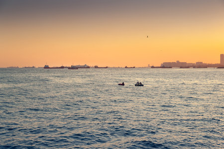 Ships on the roadstead in the Marmara Sea in Istanbul at sunset. Warm evening toning. Istanbul. Turkey. 09,25,2021.のeditorial素材