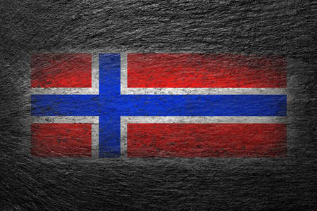 Norway flag. Norwegian flag is painted on a black stone. creative background.の写真素材
