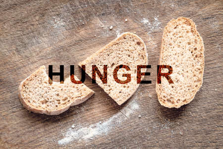 Hunger in the world. food crisis. Failed grain crops. Bread shortage. Russia's military aggression against Ukraine. The global threat of famine to the whole world. economic crisis.の写真素材