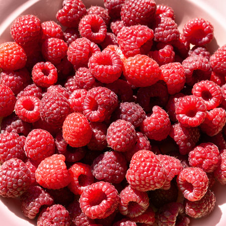 Raspberry berries. Top view raspberries in a bowl. selective soft focus. Small depth of field....