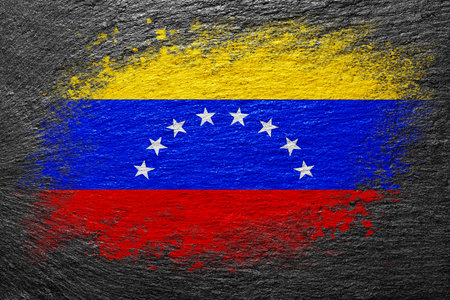 Flag of Venezuela. Flag is painted on a stone surface. stone background. Black slate background. creative backgroundの写真素材