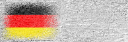 Flag of Germany. Flag is painted on a cement wall. cement background. Plastered surface. copyspace. textured creative backgroundの写真素材