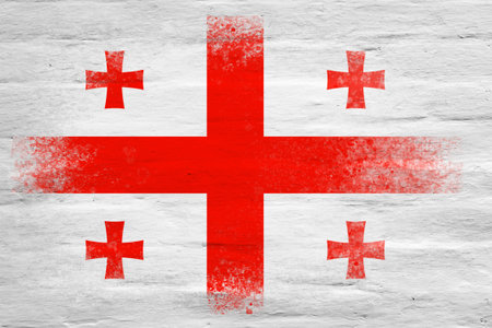 Flag of Georgia. Flag painted on a white plastered brick wall. brick background. copyspace. textured creative backgroundの写真素材