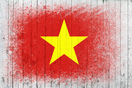 Flag of Vietnam. Flag is painted on a white wooden surface. wooden background. Plywood surface. copyspace. textured creative backgroundの写真素材